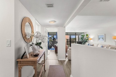 Positioned mere steps from the shoreline, this three-bedroom - photo 9