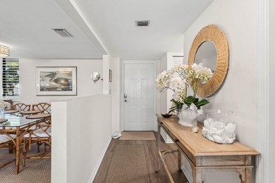 Positioned mere steps from the shoreline, this three-bedroom - photo 10
