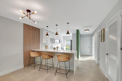 RENOVATED, MOVE-IN READY VILLA. Experience effortless Florida - photo 3