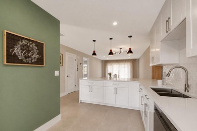 RENOVATED, MOVE-IN READY VILLA. Experience effortless Florida - photo 9