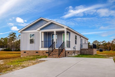 Discover simple coastal living at 936 Willow Place SW. This - photo 1