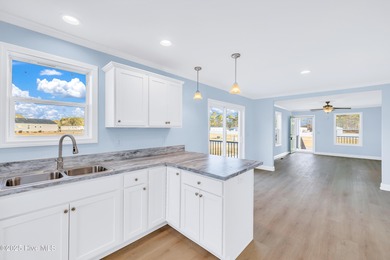 Discover simple coastal living at 936 Willow Place SW. This - photo 3