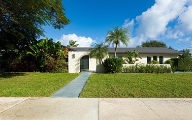 Tucked away on an oversized corner lot in the sought-after - photo 1