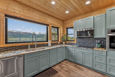 Set on 80 feet of deep-water shoreline along Lake Cascade, this - photo 21