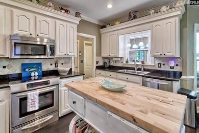 Nestled on a beautifully private one-acre lot along the shores - photo 14
