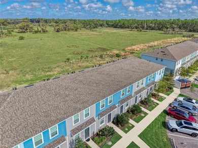 Own this practically brand-new townhome in the highly sought - photo 3