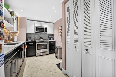 Experience coastal luxury in this gated condo at Palm Beach - photo 14