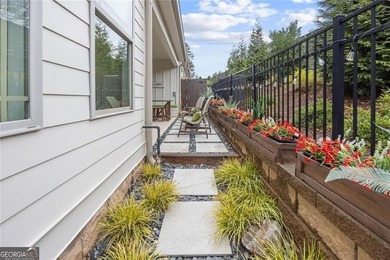 Tucked in the heart of Bridgemill, this luxury townhome lives - photo 12