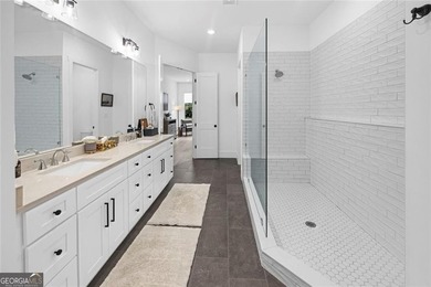 Tucked in the heart of Bridgemill, this luxury townhome lives - photo 14