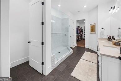 Tucked in the heart of Bridgemill, this luxury townhome lives - photo 15