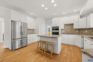 Located in desirable Glenmore, this four bedroom, three and a - photo 16