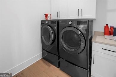 Tucked in the heart of Bridgemill, this luxury townhome lives - photo 17