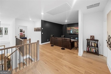 Tucked in the heart of Bridgemill, this luxury townhome lives - photo 18