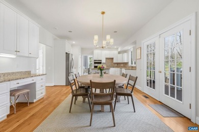Located in desirable Glenmore, this four bedroom, three and a - photo 19