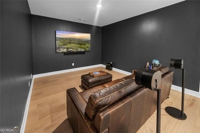 Tucked in the heart of Bridgemill, this luxury townhome lives - photo 19