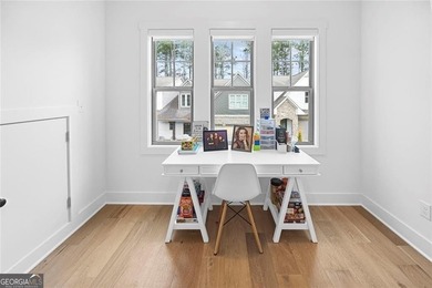 Tucked in the heart of Bridgemill, this luxury townhome lives - photo 22
