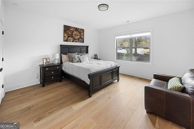 Tucked in the heart of Bridgemill, this luxury townhome lives - photo 24