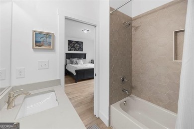 Tucked in the heart of Bridgemill, this luxury townhome lives - photo 26