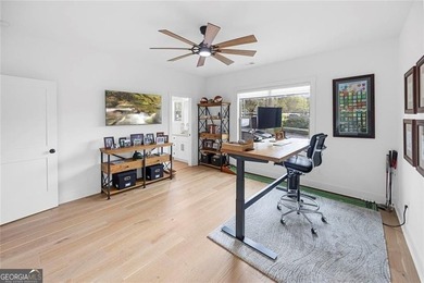 Tucked in the heart of Bridgemill, this luxury townhome lives - photo 28