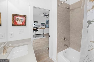 Tucked in the heart of Bridgemill, this luxury townhome lives - photo 29