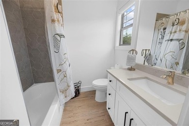 Tucked in the heart of Bridgemill, this luxury townhome lives - photo 30