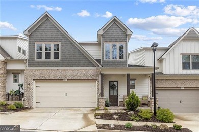 Tucked in the heart of Bridgemill, this luxury townhome lives - photo 32