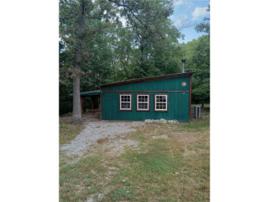 This cozy lil house is located on over three acres of - Lake Home For Sale in Berryville, Arkansas