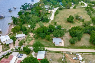 HOME WITH 8 LOTS ADJOINING EAGLE MOUNTAIN LAKE.  Home is being - Lake Home For Sale in Azle, Texas