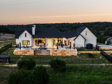 Set on 5.01 acres with a seasonal creek and natural spring, this - photo 39