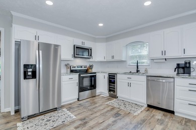 Located just 20 minutes from Evans, this updated Modoc lakehouse - photo 25
