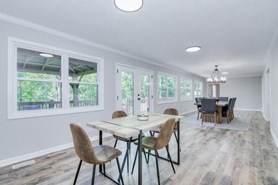 Located just 20 minutes from Evans, this updated Modoc lakehouse - photo 28