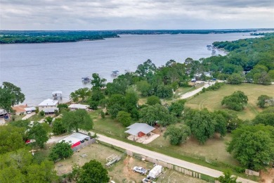 6 Lots adjoining Eagle Mountain Lake.  Back side of properties - Lake Lot For Sale in Azle, Texas