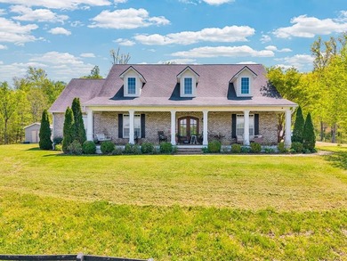 Set at the end of a private drive, this custom-built home sits - photo 1