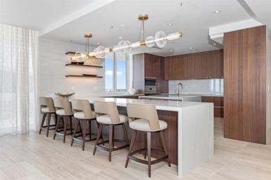 Indulge in the pinnacle of coastal luxury with this