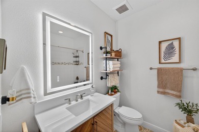 Experience elevated waterfront living in this impeccably updated