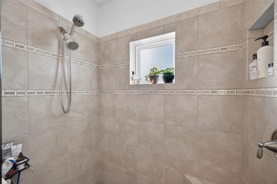 Experience elevated waterfront living in this impeccably updated