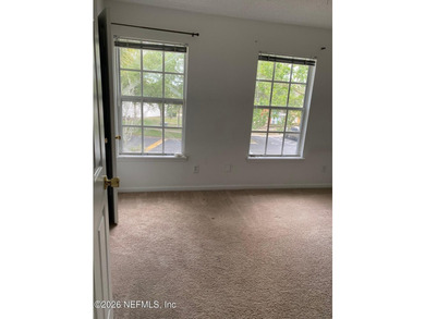 This spacious end-unit condo offers an inviting open floor plan - photo 17