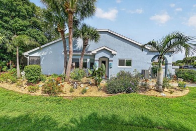 This sought-after, move-in-ready corner unit villa in the - photo 2