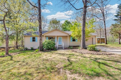 Charming 3BR/2BA home on a level lot just minutes from town in a - photo 1