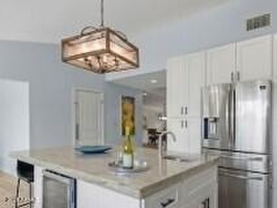 This 3-bed, 3-bath home was luxuriously updated in 2020 and is - photo 6