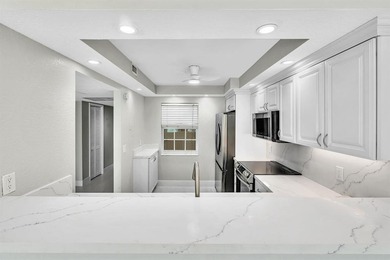 FULLY renovated second-floor 3-bedroom, 2-bath home combining