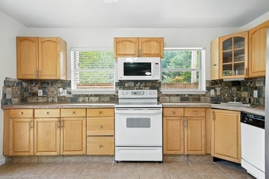 Find lakefront bliss in this charming & spacious home that sits - photo 34