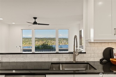 Perched above Lake Washington in one of the Island's most - photo 13