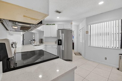 This beautifully renovated 3-bedroom, 2-bath home is tucked away - photo 12