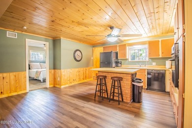 Peaceful lake living meets timeless character in this inviting - photo 13
