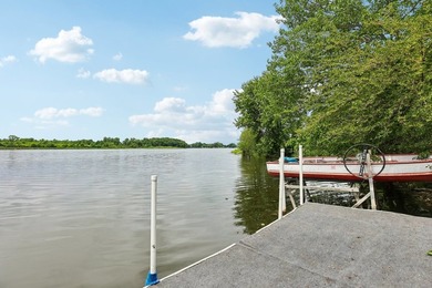 Discover an unparalleled Chain of Lakes lakefront retreat, with - photo 32