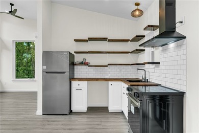 Experience modern lakeside living in Springdale with this newly - photo 8