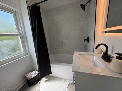 Welcome home to this stunning, fully renovated Euclid gem, where - photo 22