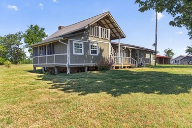 Nestled in the rolling hills of Tennessee, this historic cabin - photo 3