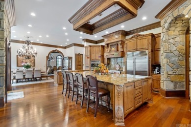 Tucked inside the gated Valley Falls Estates, this custom home
